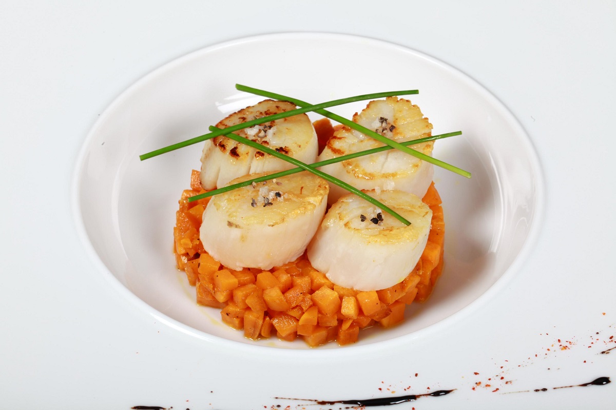Coquilles SaintJacques avec de la mangue Huiles d'Olive d'Espagne